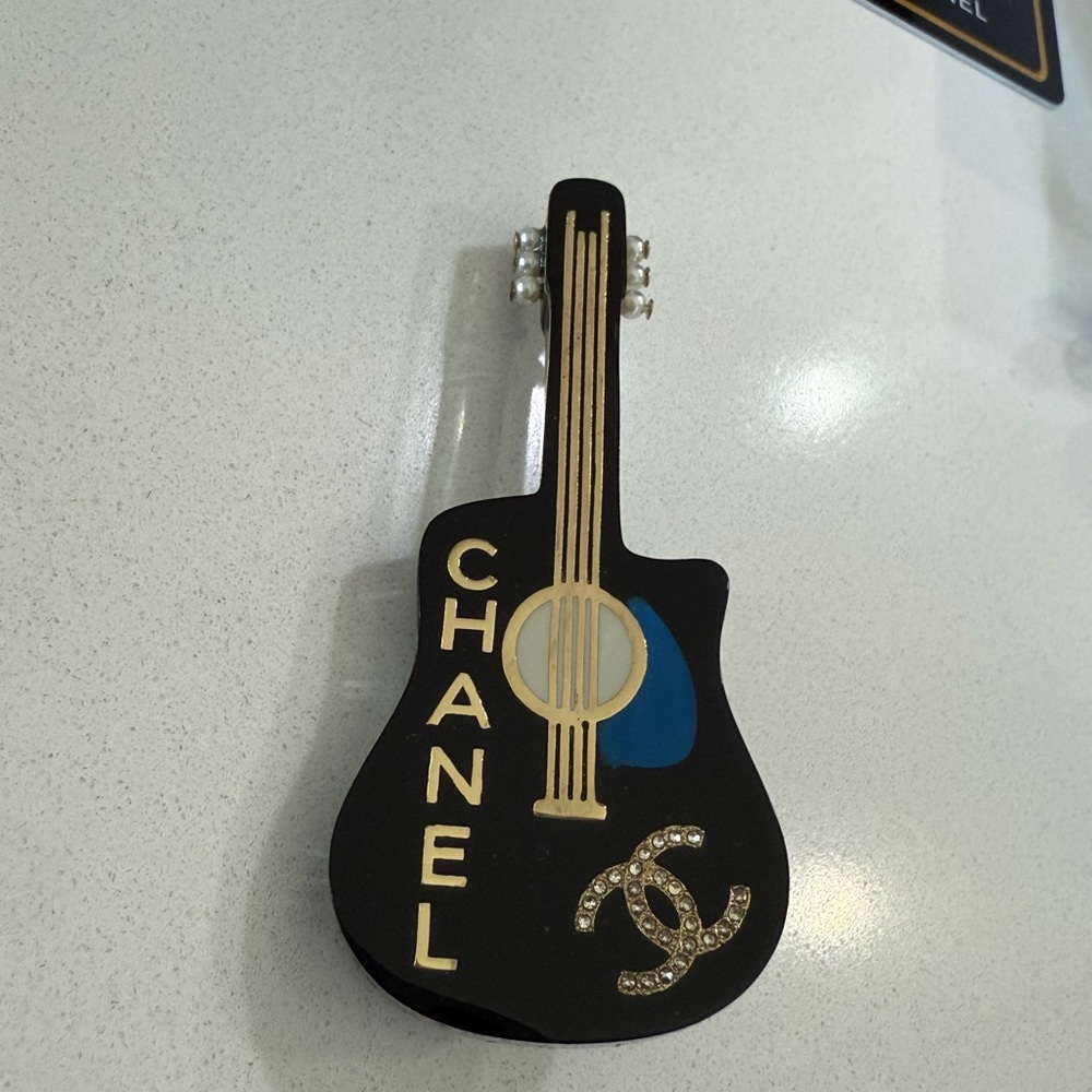 CHANEL Black and Gold Guitar Brooch
